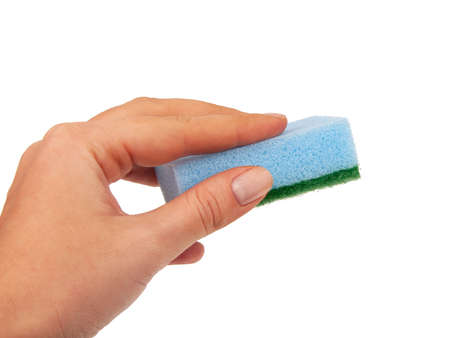 Sponge for washing dishes in hand isolated on the whiteの写真素材