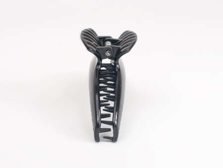 Black hairclaw for hairstyle isolated on the whiteの写真素材
