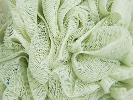 Green puff sponge for shower bath care textureの写真素材