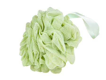 Green puff sponge for shower bath isolated on the white backgroundの写真素材