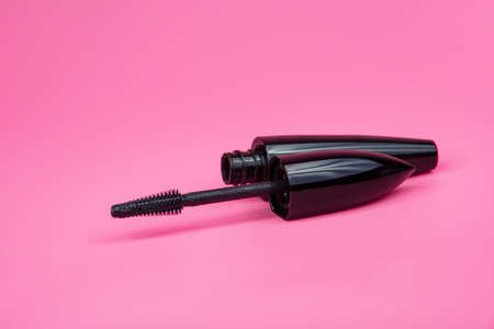 Black tube mascara for lashes make up on pink backgroundの写真素材