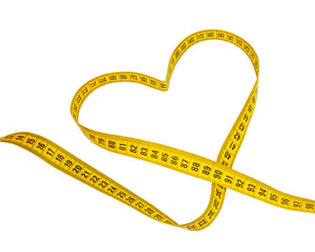 Yellow heart tape measure isolated on the white backgroundの写真素材