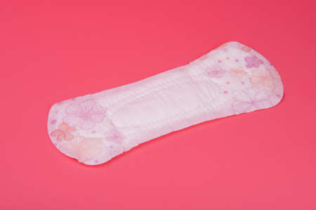 cotton medical towel or pad for women critical days on pink background. Care and protection.の写真素材