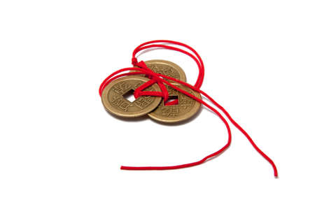 three chinese lucky coins with red knot on the white