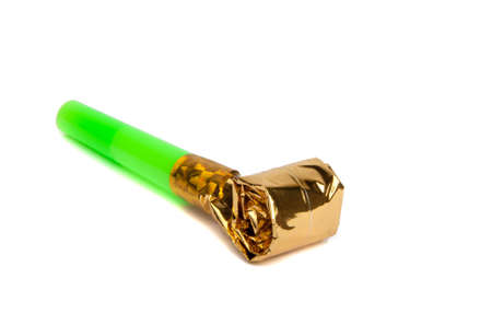 Party foil whistle on the white background