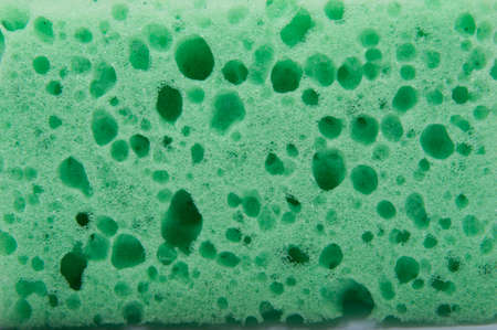 Kitchen sponge for dish isolated on the whiteの写真素材