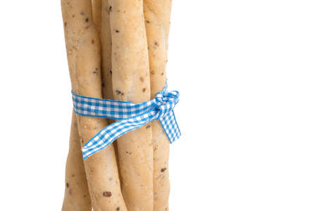 Bread sticks italian snack with blue ribbon isolated on the whiteの写真素材