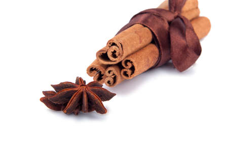 Cinnamon sticks with ribbon isolated on the white