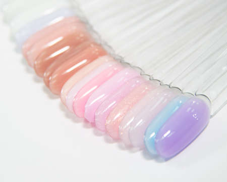 Multicolor different palette gel varnishes examples for manicure on the white background