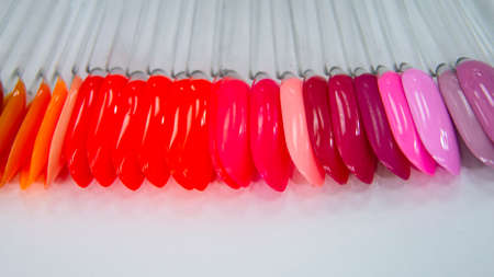 Multicolor different palette gel varnishes examples for manicure on the white background