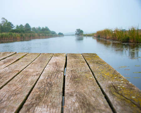 Old wooden pier on river nature beauty of silenceの写真素材