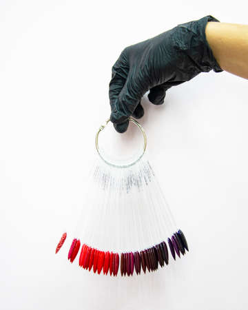 Multicolor different palette gel varnishes examples for manicure in hand selective focus