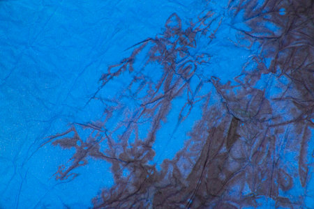 Blue crumpled paper decorative background textureの写真素材