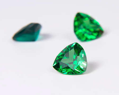Elegant emerald green stone diamond jewelry on the whiteの写真素材