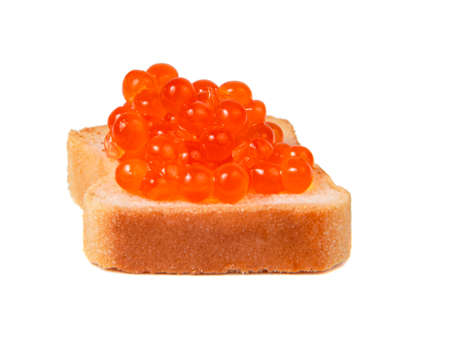 Small toast with red caviar tasty food isolated on the whiteの写真素材
