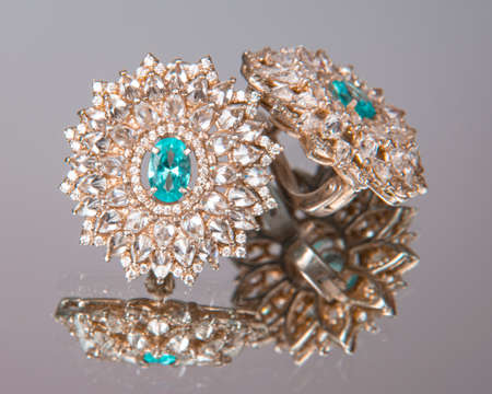 Diamond earrings with blue stone luxury jewerly macro close upの写真素材