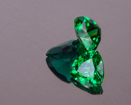 Elegant emerald green stone diamond jewelry on the whiteの写真素材