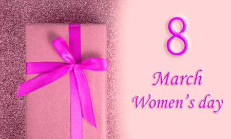 Craft gift box purple color bow on shiny background with copyspace 8 march national women's dayの写真素材