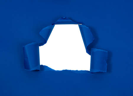 Blue crushed torn paper with hole copyspace background for ideaの写真素材