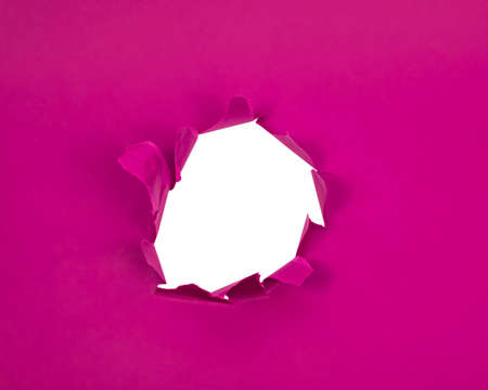 Pink crushed torn paper with hole copyspace background for ideaの写真素材