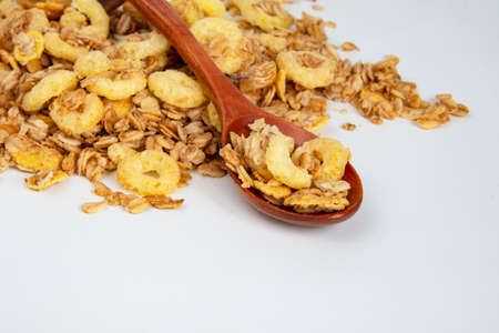 Oatmeal cereal breakfast in wooden spoon textured background