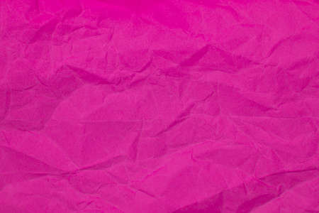 Crumpled pink paper craft textured backgroundの写真素材
