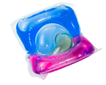 washing powder for colored laundry in a capsule cleaning gel isolated on white backgroundの写真素材