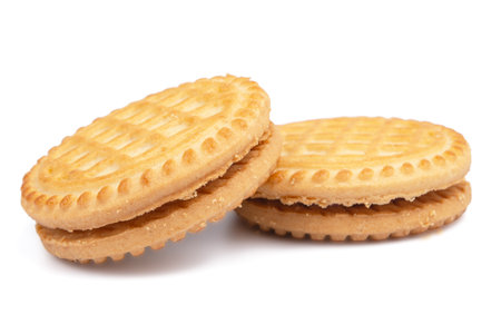 Sandwich biscuits with chocolate filling on a white backgroundの写真素材