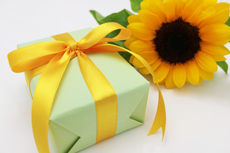 Gift and sun flower の写真素材