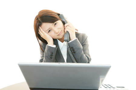 Woman of uneasy expressionの写真素材