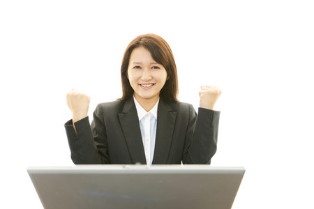 The female office worker who poses happilyの写真素材
