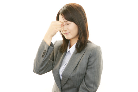 Business woman having a headacheの写真素材