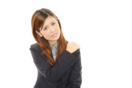Business woman with shoulder pain の写真素材