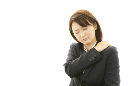 Business woman with shoulder pain の写真素材