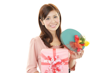 Smiling woman with a giftの写真素材
