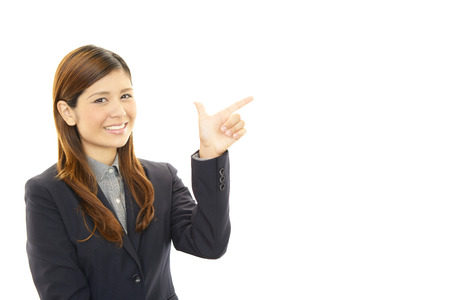 Business woman showing something on the palm of her handの写真素材