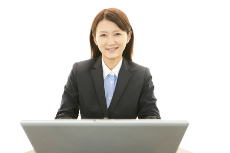 Business woman working on laptopの写真素材