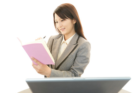 Business woman working on laptopの写真素材