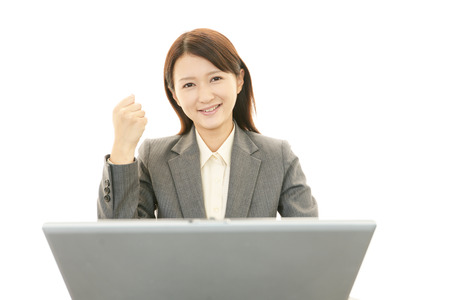 The female office worker who poses happilyの写真素材