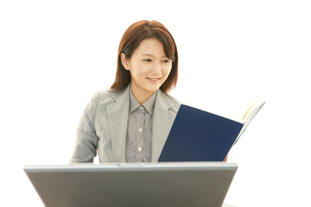 Business woman working on laptopの写真素材