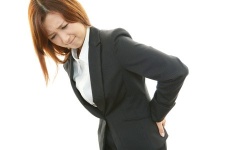 Business woman with low back painの写真素材