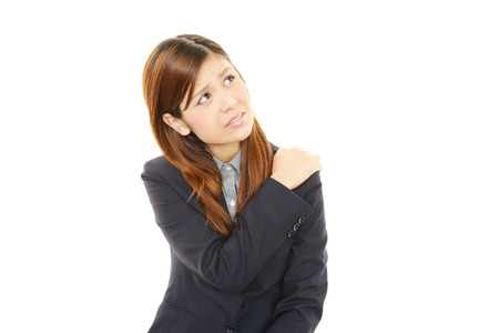 Business woman with shoulder pain の写真素材