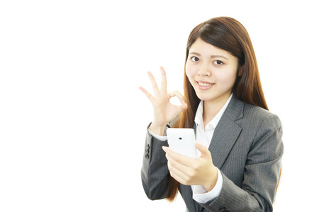 Business woman showing something on the palm of her handの写真素材