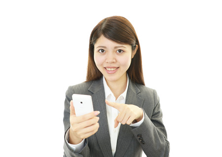 Woman with smart phoneの写真素材