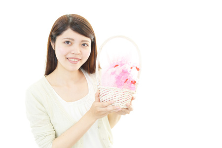 The woman who smiles with a presentの写真素材