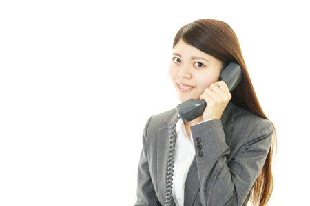 Woman with smart phoneの写真素材