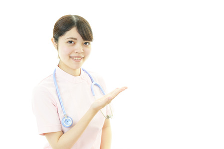 Young female nurse pointingの写真素材