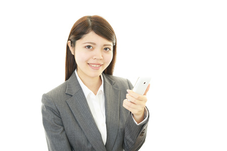 Woman with smart phoneの写真素材