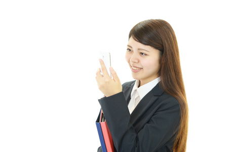 Woman with smart phoneの写真素材