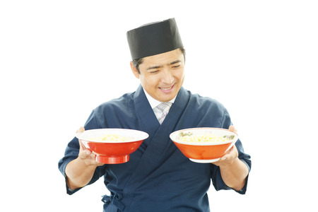 Asian chef with noodleの写真素材